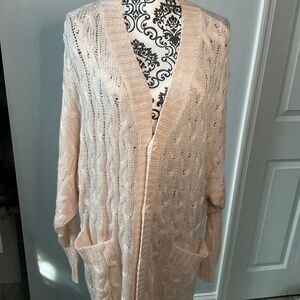 Light peach cardigan.